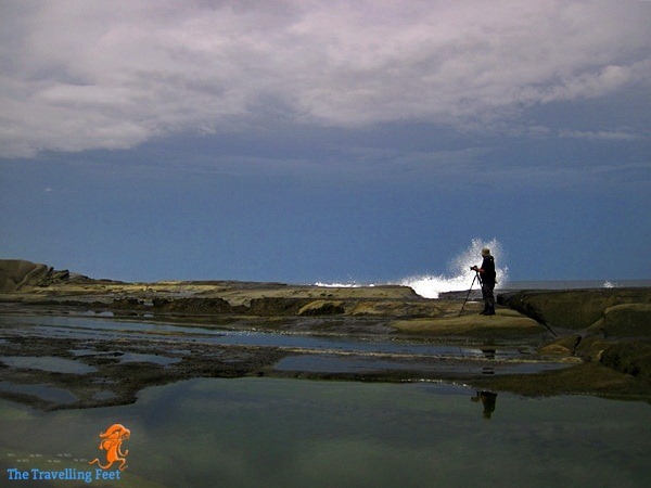 Christian taking photos of waves in Biri Island